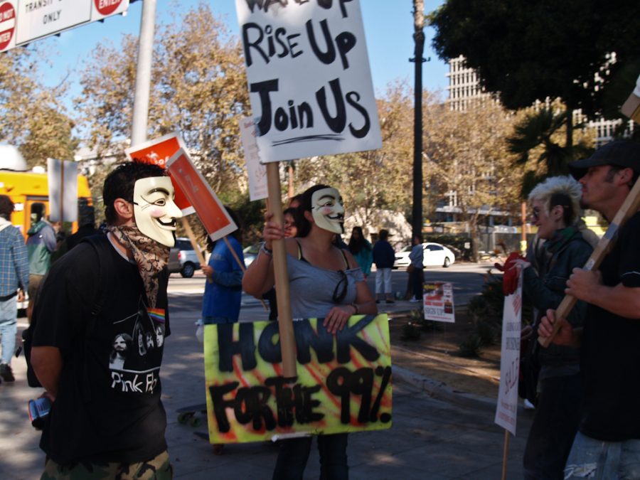 Occupy LA protesters wore Guy Fawkes masks inspired by the 2006 movie V for Vendetta on Saturday, November 5, 2011. Participants marched to commemorate bank transfer day. | Courtesy of Ashley Bornancin