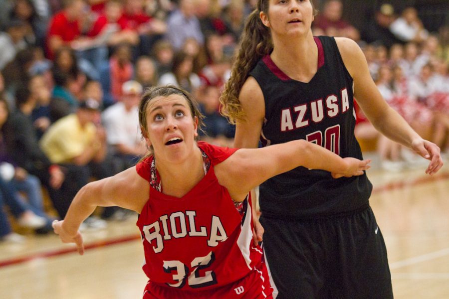 Freshman guard Amy Freet fights for position against an APU defender. | Tyler Otte/THE CHIMES