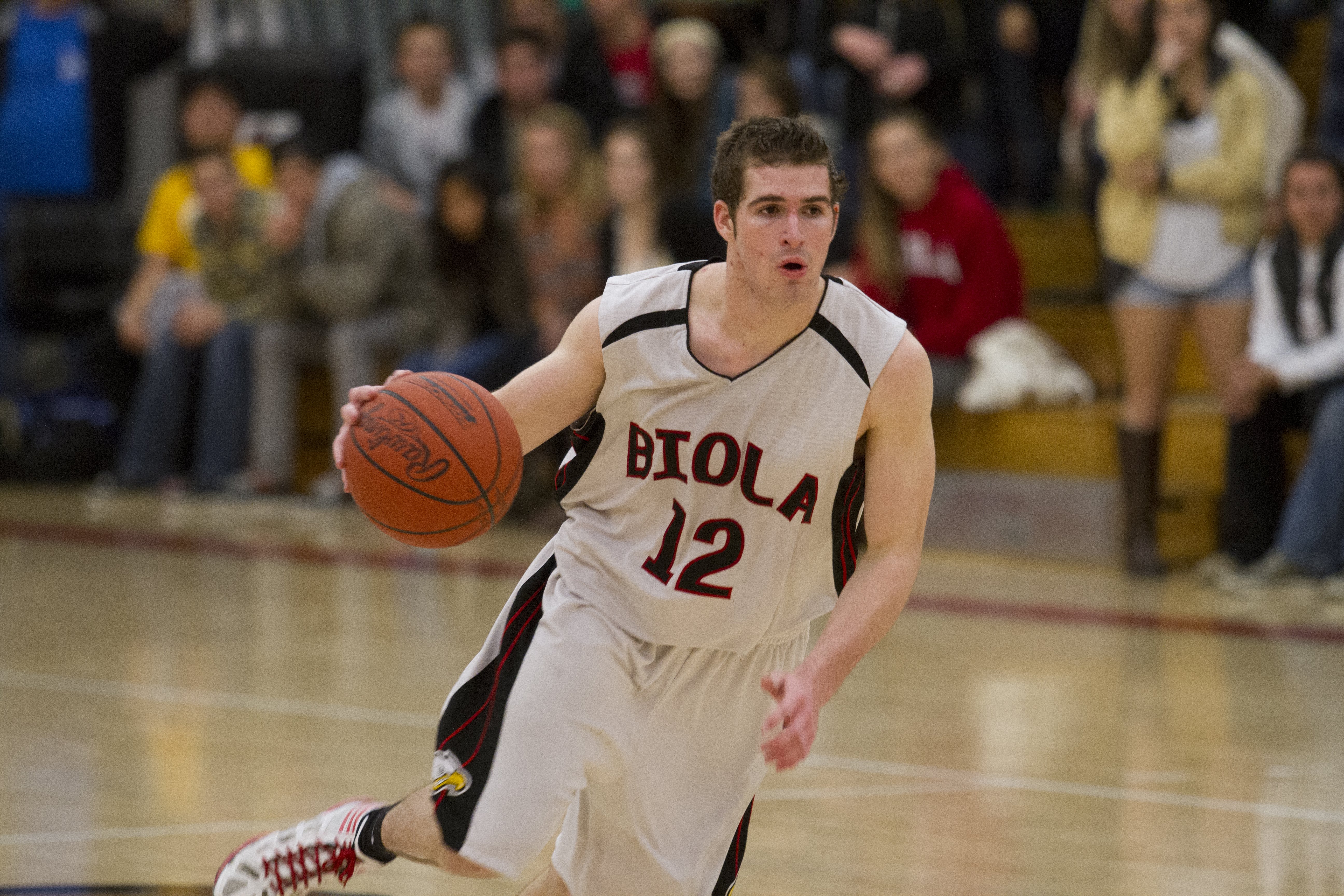 Cody Anderson, freshman, dribbles during Biola's victory over Master's on Thursday night. | Tyler Otte/THE CHIMES