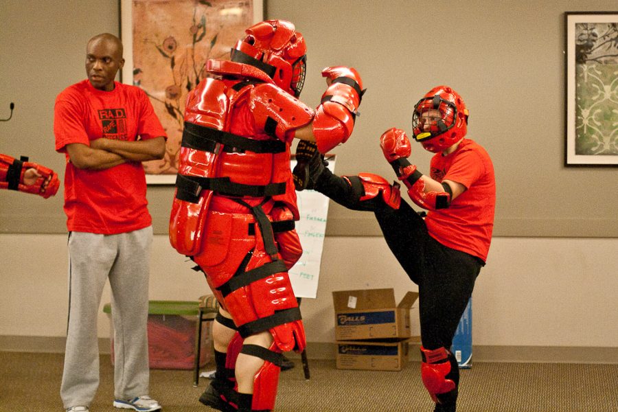 Freshman Ashley Adams fights off a potential attacker in a mock fight against sexual predators at a RADS event for Sexual Violence Awareness Week on Tuesday, April 24, 2012. 
