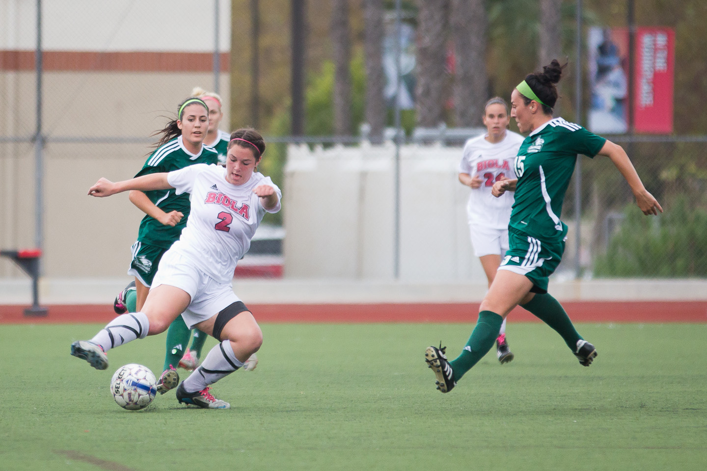 Junior Michelle Andre pushes forward, preventing Concordia University from advancing toward the goal in Saturday's game. Grant Walter/THE CHIMES