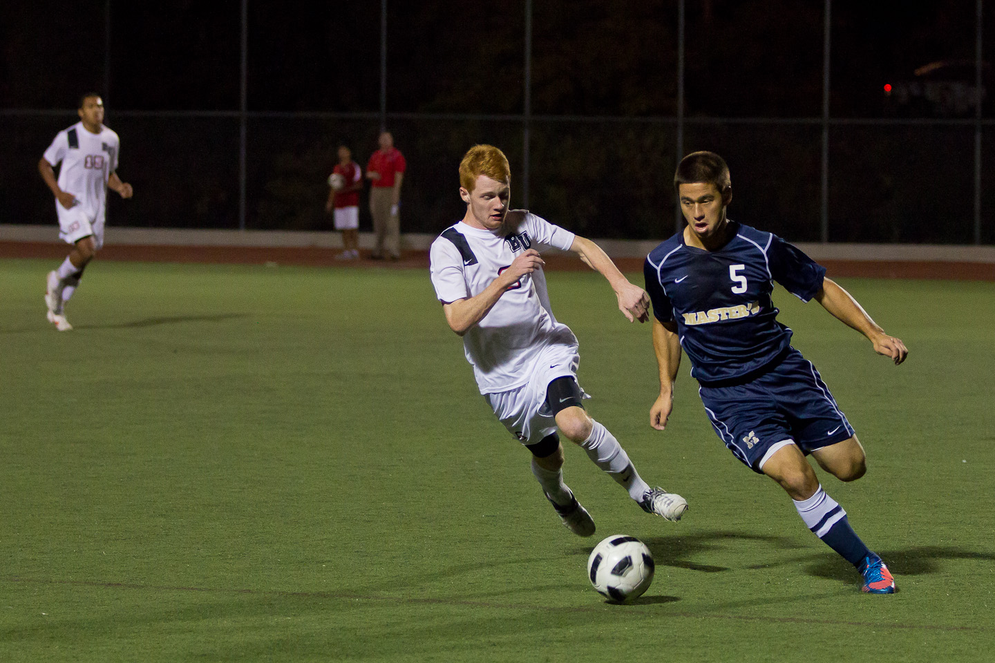 Freshman middle fielder John Hanscom hustles to steal the ball from Master's College. | John Buchanan/THE CHIMES