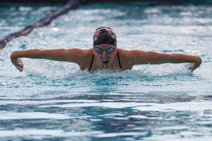 Junior Monica Hurt swims the fly during the PCSC Relays held at Splash! Aquatics Center on Friday. Olivia Blinn/THE CHIMES