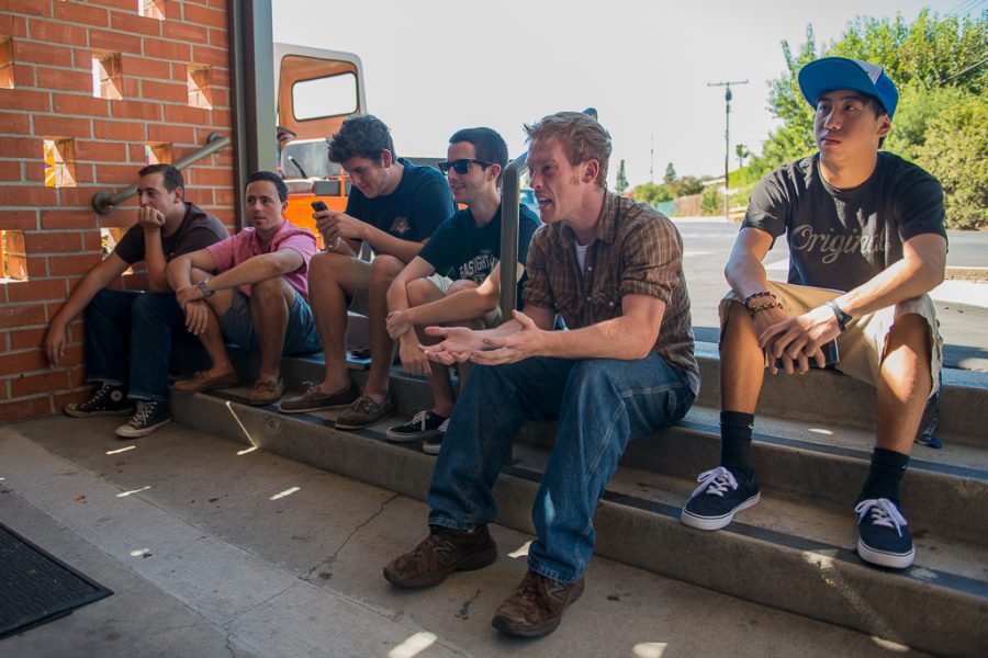 (Left to right) Junior Kyle Melin, junior Carlo Dangelo, sophomore Brad Winsbury, senior Tim Stensbol, junior Kent Reister, and freshman Joseph Illescas were left with only the steps outside Sutherland to hear the Wednesday afternoon session of Torrey Conference. They called their spot the “overflow-overflow.” | Olivia Blinn/THE CHIMES