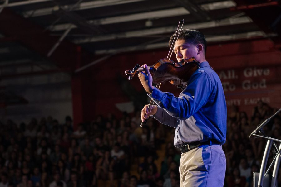 Allen Yeh illustrates explicit and implicit proclamation by playing a few songs on his violin, including Come Thou Fount. | Olivia Blinn/THE CHIMES