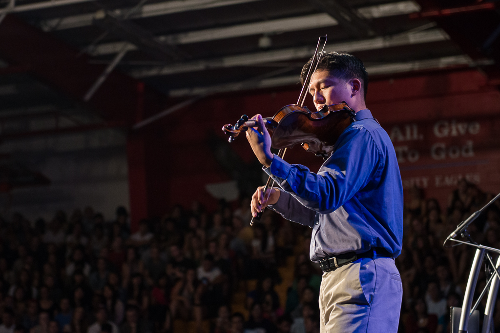 Allen Yeh illustrates explicit and implicit proclamation by playing a few songs on his violin, including "Come Thou Fount." | Olivia Blinn/THE CHIMES