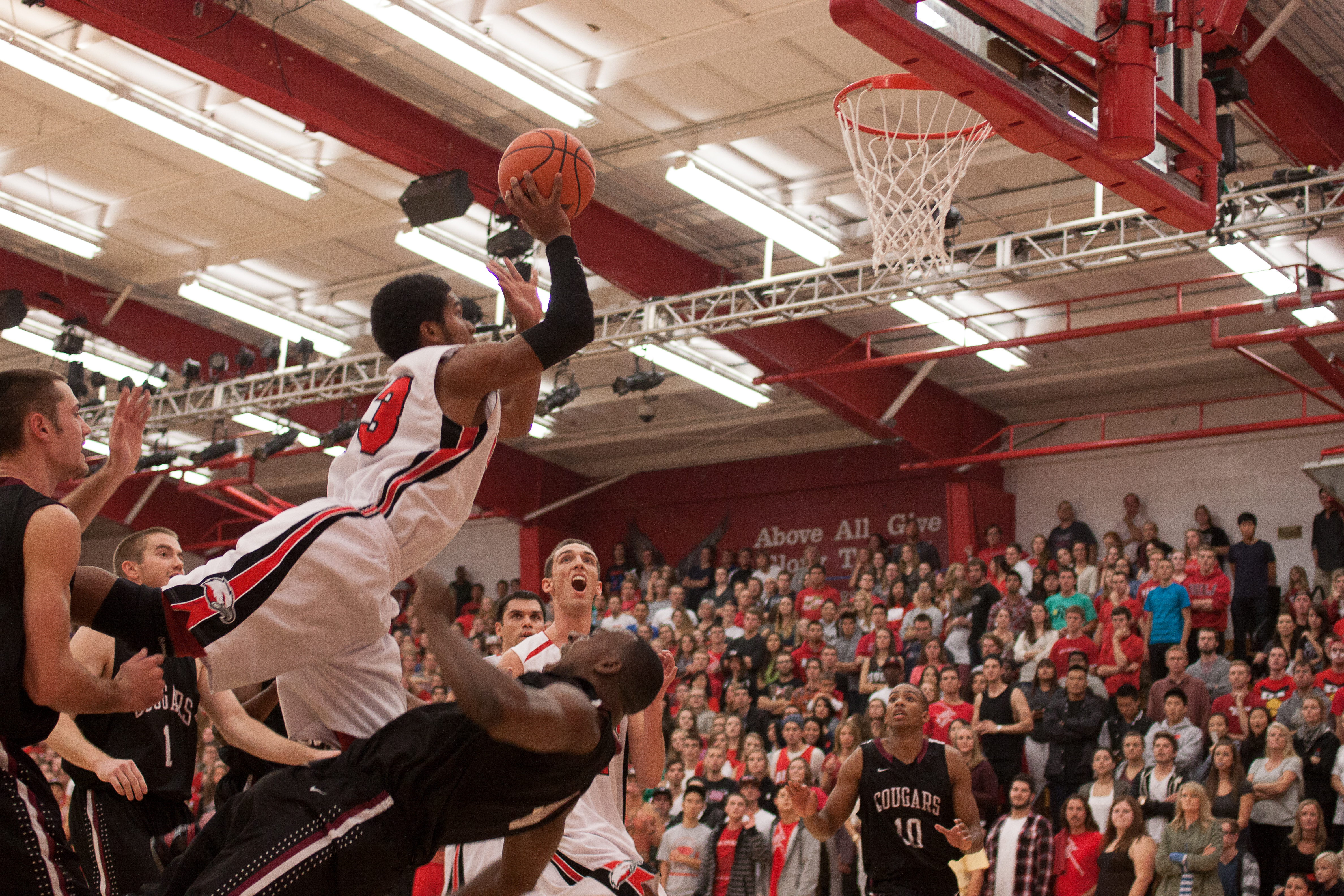 Freshman guard Christopher Jones drives over several defenders to the basket. | Grant Walter/THE CHIMES