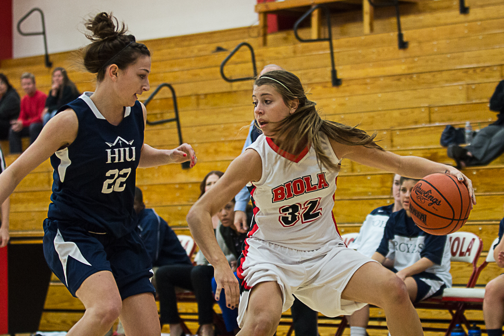 During Tuesdays game against Hope International University, sophomore Amy Freet dribbles past a defender. | John Buchanan/THE CHIMES