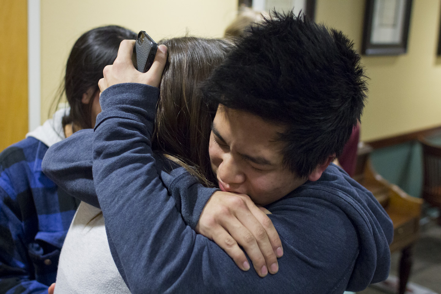 Junior Evan Tan and sophomore Becky Gallacher share a hug after hearing the election results. | John Buchanan/THE CHIMES