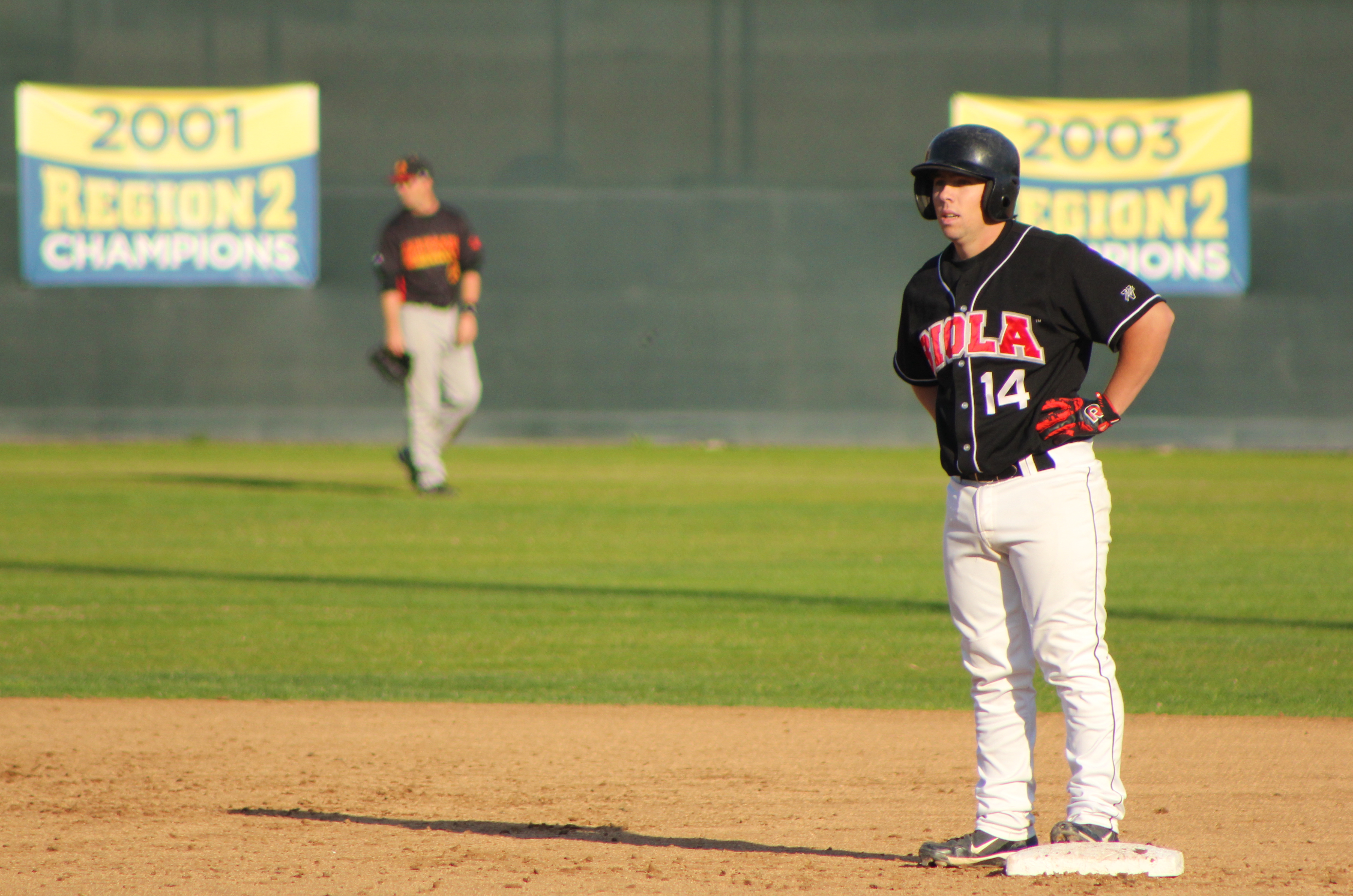 Freshman Sam Thorne stands safely at second base after an RBI-double in Saturday’s loss to Arizona Christian University. | Conner Penfold/THE CHIMES