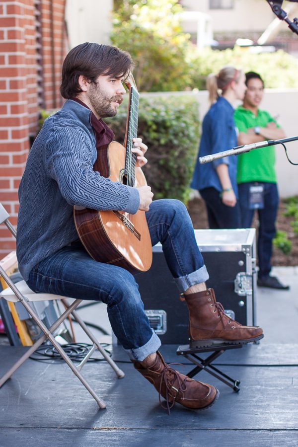 Senior Caleb Parker provides an open air concert for those attending the Church/Ministry/Art Fair. | Grant Walter/THE CHIMES