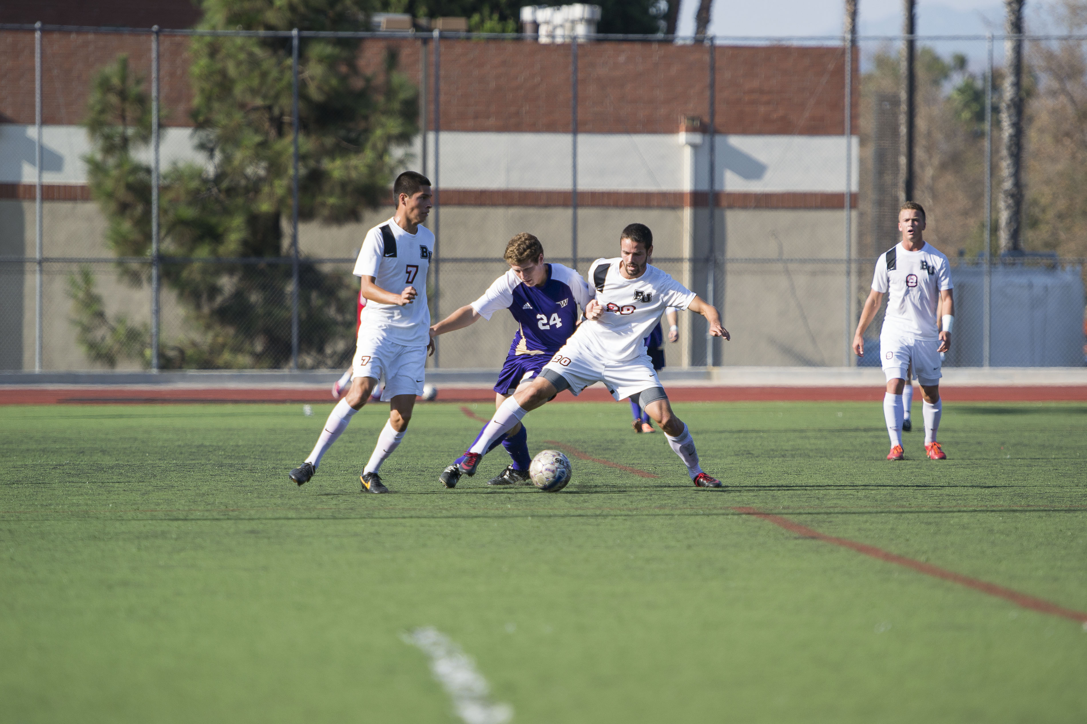 Sophomore Steven Tanquary wins the ball back from a Westminster player. Tanquary has given the Eagles an offensive spark the past few games, scoring three goals in the last three games and adding an assist. | Kalli Thommen/THE CHIMES