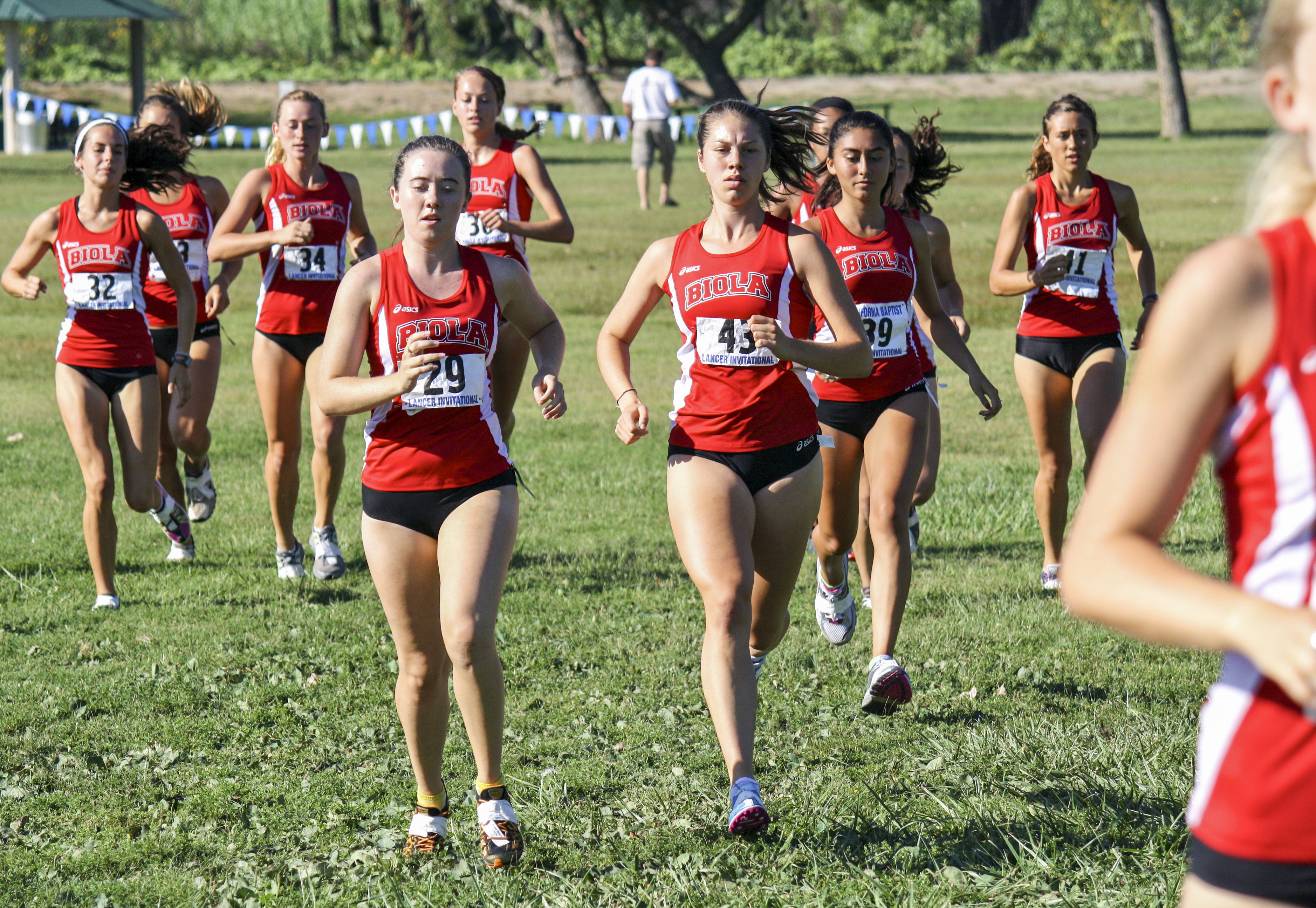 Sophomore Brooke Arvidson and junior Carrie Soholt lead the group of Biola women during the California Baptist University Lancer Invitational on September 7. | Courtesy of Jessi Kung