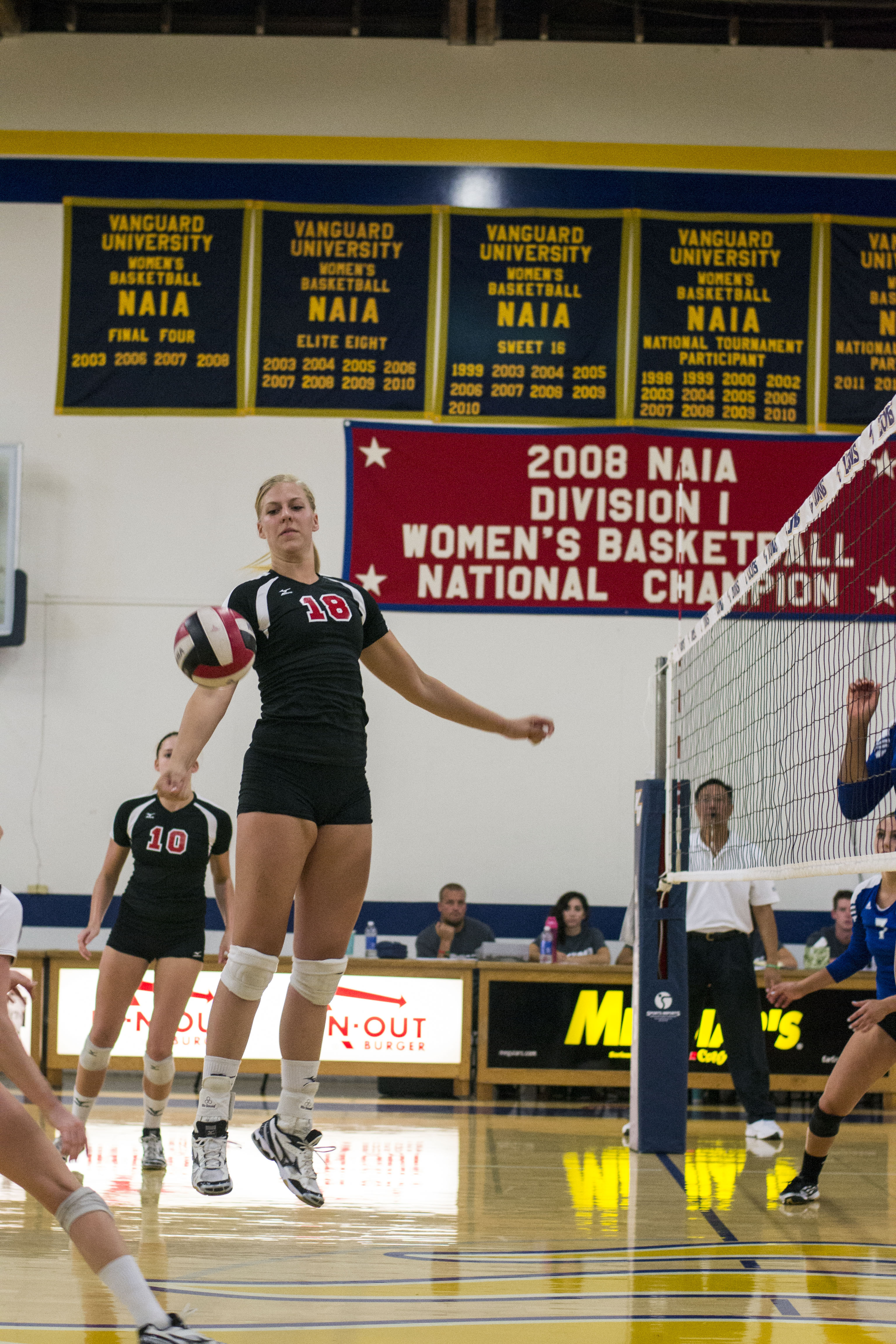 Senior Amy Weststeyn saves a ball from hitting the floor by completing a last minute, one-handed pass over the net. | Rachelle Cihonski/THE CHIMES