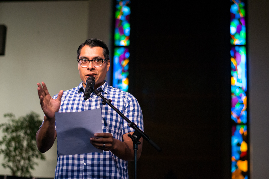 Jonathan Calvillo, adjunct professor of sociology, performs spoken word titled The Recipe, sending the audience through a sensory experience of what dinners are like in his home. | Ashleigh Fox/THE CHIMES