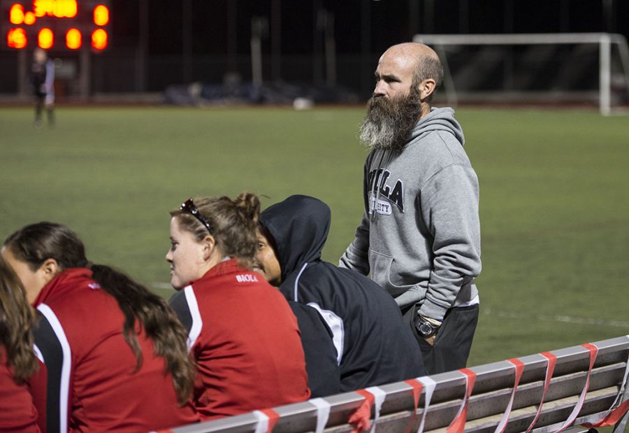 Coach+Todd+Elkins+stands+patiently+on+the+sideline+as+his+womens+soccer+team+battles+Arizona+Christian+on+October+29.+Elkins+coaches+both+men+and+womens+teams+for+Biola.+%7C+Natalie+Lockard%2FTHE+CHIMES