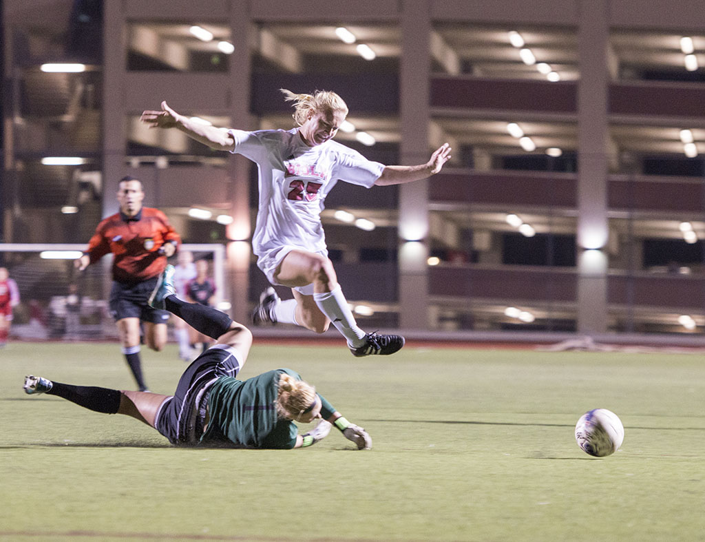 Sophomore forward Brittney Sayre avoids colliding with a player during the game versus Westmont on October 12. The game ended in a 0-0 tie after two sudden-death overtimes. | Ashleigh Fox/THE CHIMES