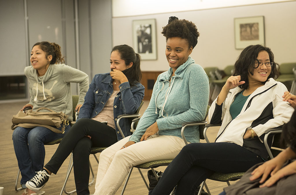 Junior Alex Palacios, sophomore Veronica Ibarra, senior Ciara Dines and senior Kim Davong listen intently to the speakers during Unidos, a club on campus that celebrates what it means to be Latino within a Christian community. Unidos' next event will be Latino Cultural Night on Friday, October 11. | Kalli Thommen/THE CHIMES