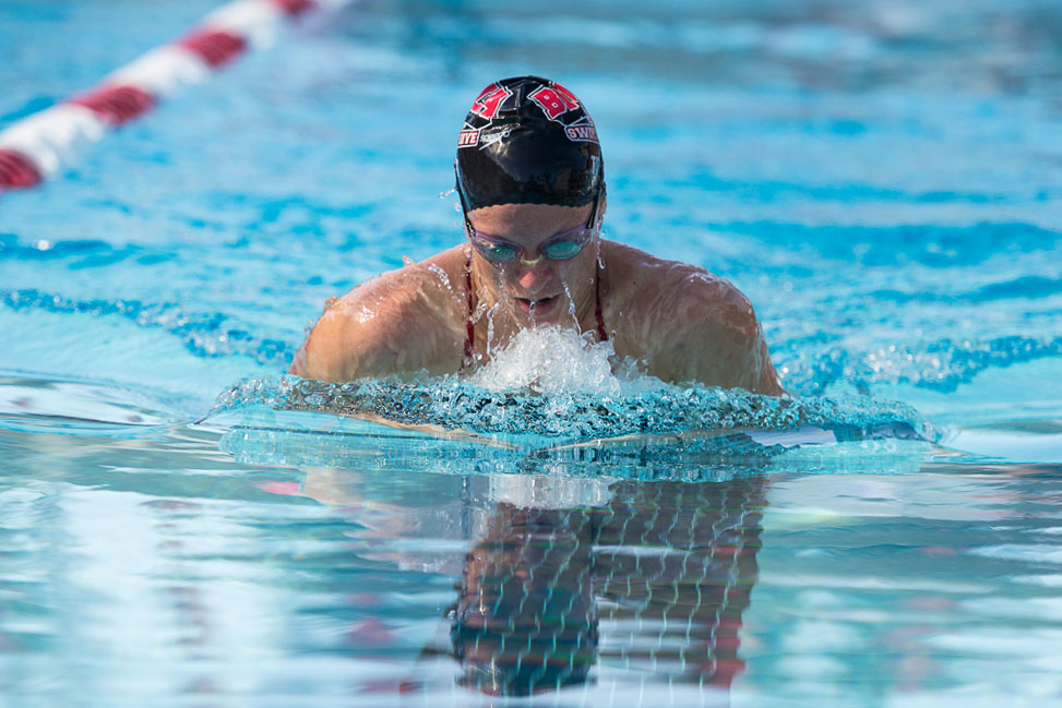 Junior Christine Tixier glides through the water with the breaststroke during the dual meet against Azusa Pacific on November 2. | Ashleigh Fox/THE CHIMES