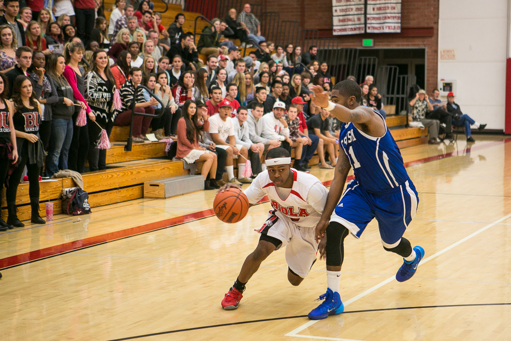 Freshman guard Dakari Archer fights against the defense during the game on November 12 versus Cal State San Marcos. The men fell to San Marcos 74-65. | Tomber Su/THE CHIMES