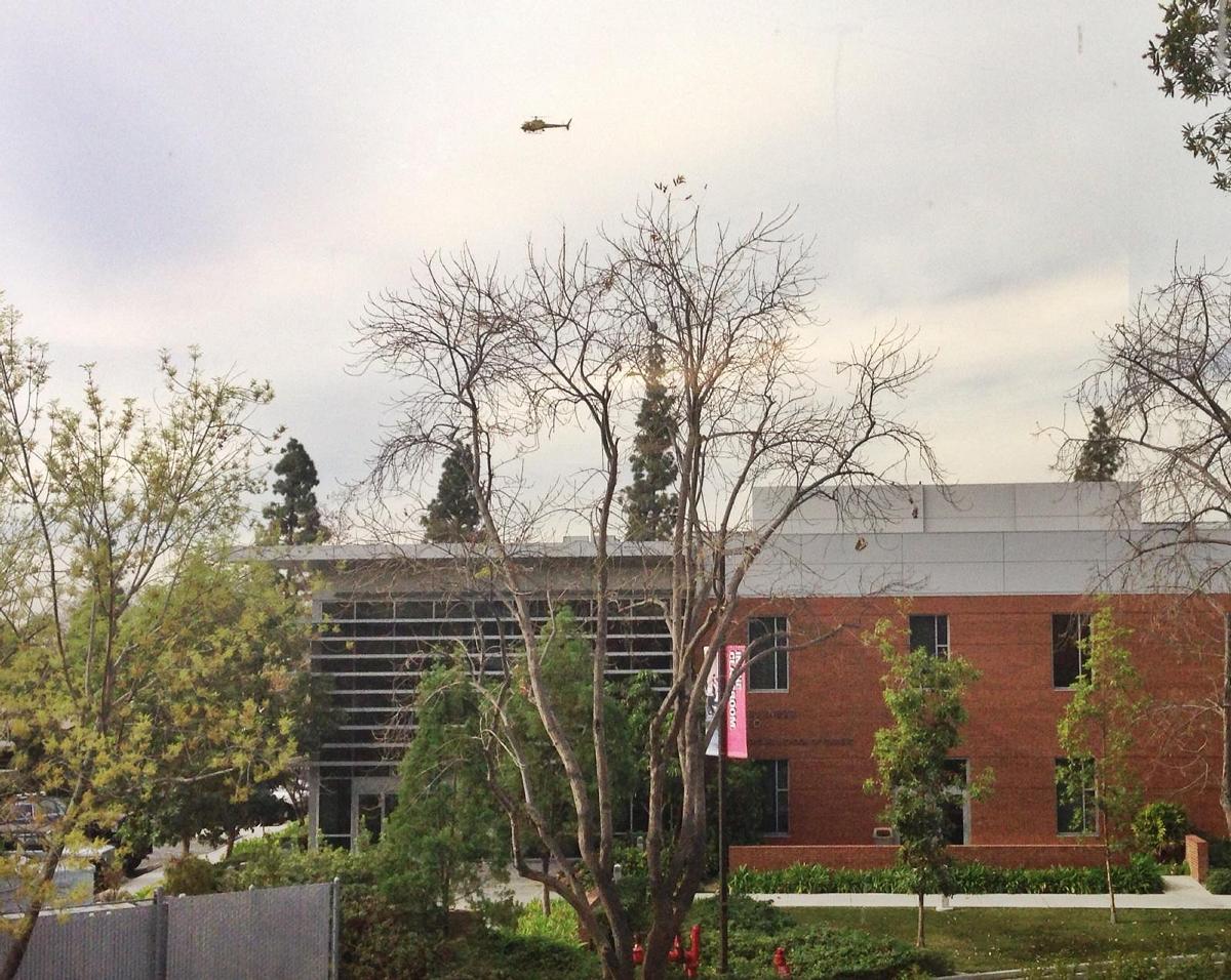 A helicopter circles overhead as the sheriff's department searches for a suspect who ran onto campus. | Courtesy of Amber Amaya