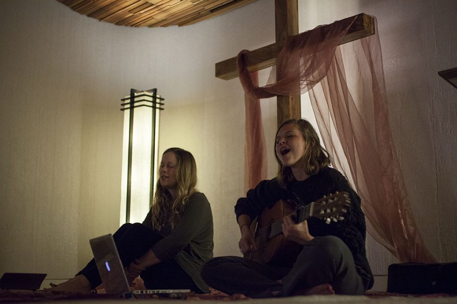 Sophomores intercultural studies major Megan Carlson and elementary education major Kate Abel lead the BHOP worship session in the Talbot East prayer room, a cross-campus change from their former location in the AS conference room. | Melanie Kim/THE CHIMES