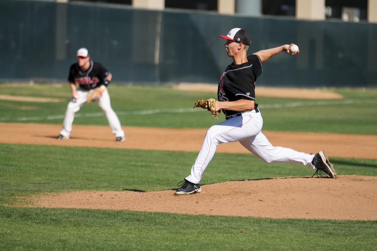 Sophomore Sean Rothfuss pitches to San Marcos during their double-header on Saturday, Feb. 15. The men dropped both games to the Cougars. | Katie Evensen/THE CHIMES