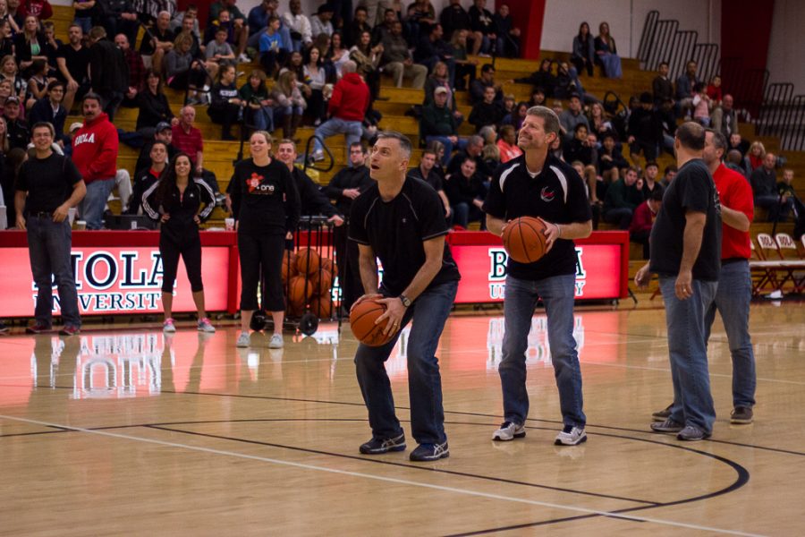 Professor Erik Thoennes squares up for a free throw during a faculty competition of knock out. Professors Thoennes, Dave Talley, Jason Oakes and president Barry Corey battled against one another for bragging rights during the halftime of the mens game versus Concordia. | Karin Jensen/THE CHIMES