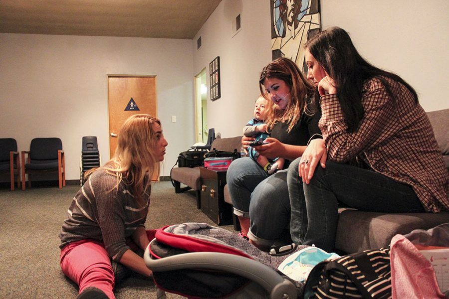 Junior Jessica Dagen, left, discusses the best ways to bond with newborns during Generation Hers Bonding with Baby class at the organizations Fountain Valley site. The nonprofit for teen moms was founded by Biola alumna Dianna Smiley in 2009. | Amber Amaya/THE CHIMES