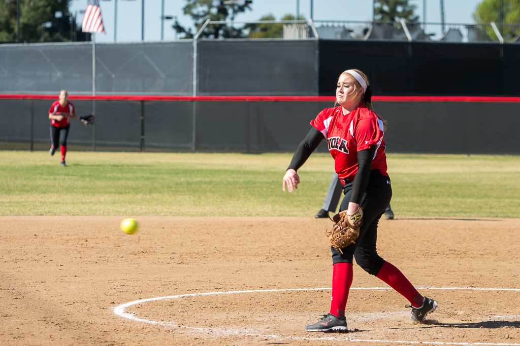 A pitch flies out of the hands of junior right-handed pitcher Reba DePriest during the game against Biola alumni last Saturday. | Ashleigh Fox/THE CHIMES