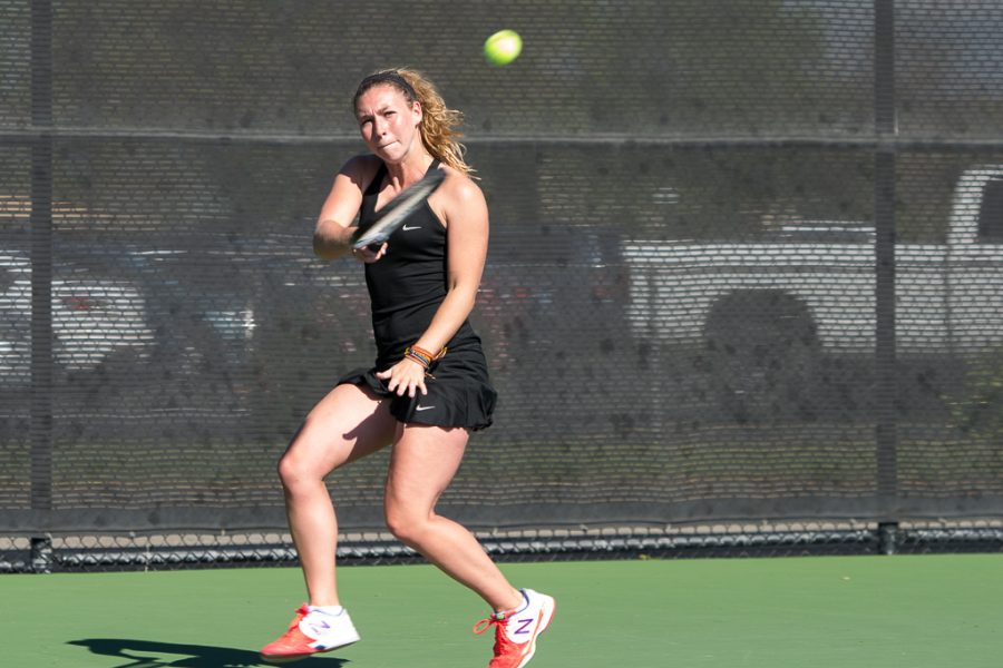 Junior Lauren Vogel swipes the ball across the net to her California Institute of Technology opponent last season. The women’s tennis team loses to Sewanee: The University of the South on March 17 by a score of 0-9. | Ashleigh Fox/THE CHIMES