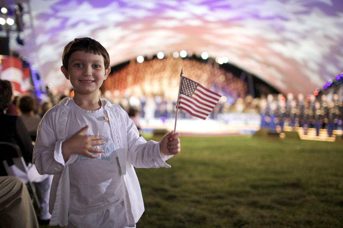 A boy holds an American flag during the 2009 National Memorial Day Concert in Washington, D.C. The Chimes staff begins a conversation about the cultural ignorance of Americans. 