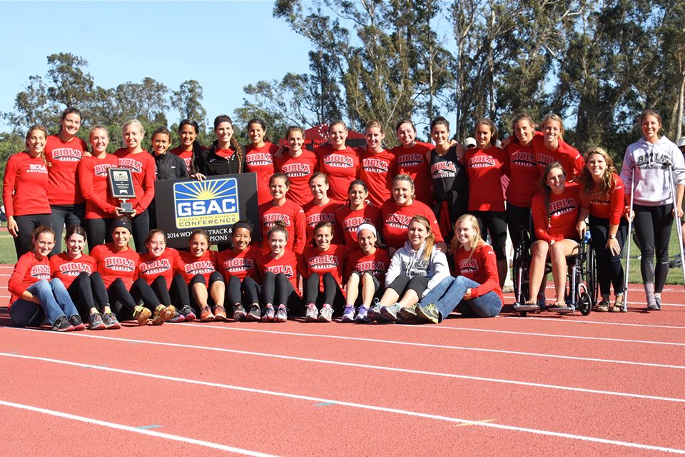 The womens track and field team members pose with their first place plaque after the completion of the GSAC championships last weekend. This is the second year in a row that the women have earned the top spot at GSAC. | Courtesy of Jonathan Zimmerman