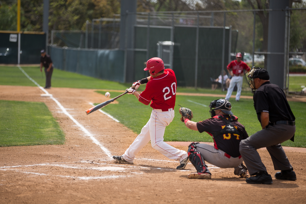 Senior Sage Poland swings in hopes of a good run during the game against Arizona Christian University last season. | Aaron Fooks/THE CHIMES [file photo]