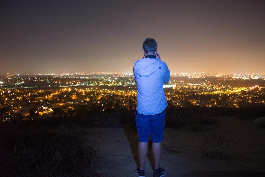 Sophomore film major Austin John takes photos of the amazing view at the Turtle Rock Hike Area in Irvine, CA. | Jenny Oetzell/THE CHIMES