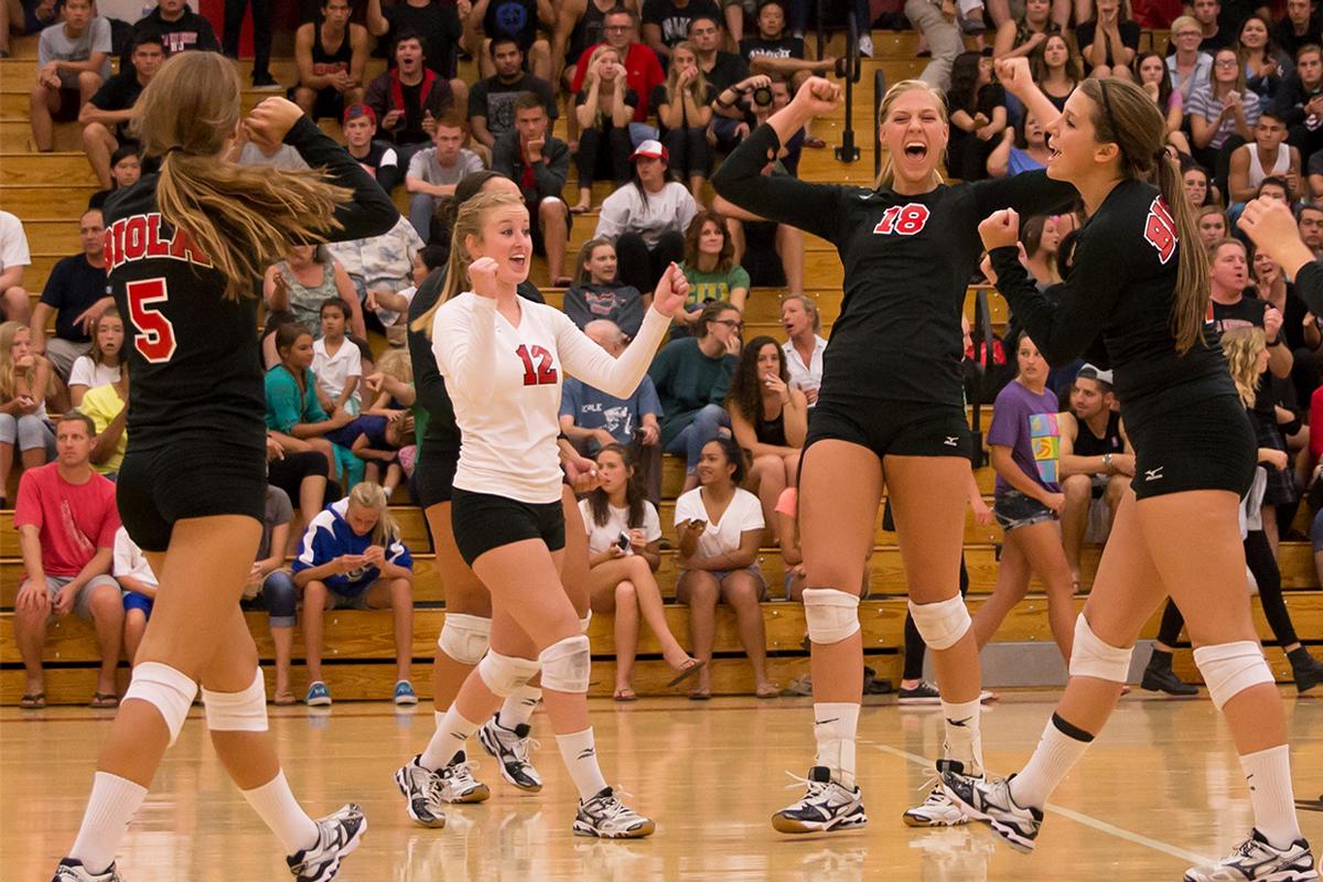 Senior middle blocker Amy Weststeyn celebrates a play with her teammates at their game against Concordia on Sept. 20. | Molli Kaptein/THE CHIMES