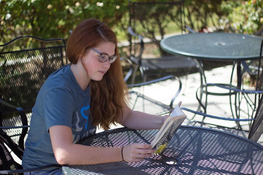 Sophomore English major Grace Hansen enjoys a book at the patio near the Flour Fountain. |
Johnathan Burkhardt 