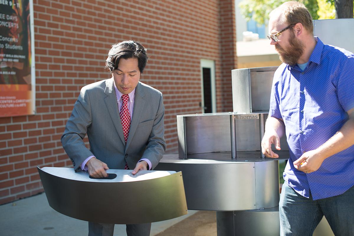 Artist Tom Tsuchiya and Earl and Virginia Green art gallery curator Jeffery Rau instal the final pieces to Tsychiya's new sculpture “The Spirit of Christ”. | Kalli Thommen/THE CHIMES