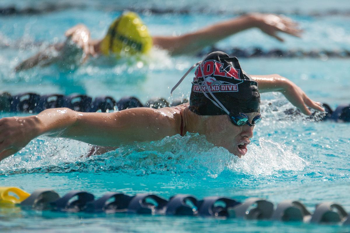 Freshman Lisa Tixier swims in the 100 yard butterfly at the Pacific Collegiate Swim and Dive meet of the season on Oct. 10-11. | Kalli Thommen/THE CHIMES