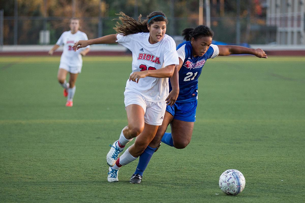 Freshman forward Samantha Verduzco battles for the ball against a William Jessup University player on Oct. 4. | Ana Waltschew/THE CHIMES