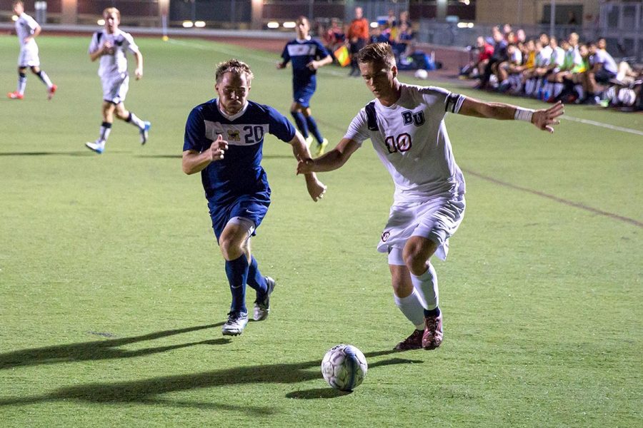 Junior midfielder Joey OKeefe runs the ball toward the goal at the Oct. 7 game against The Masters College. Though Biola dominated over the Mustangs at GSAC last year, the Eagles lost the game 2-1 last Wednesday. | Johnathan Burkhardt/THE CHIMES