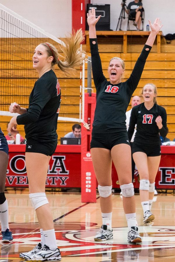 Senior middle blocker Amy Weststeyn celebrates with her teammates after a great play at the game against Texas-Brownsville last season. | Zoe Lewis/THE CHIMES [file photo]