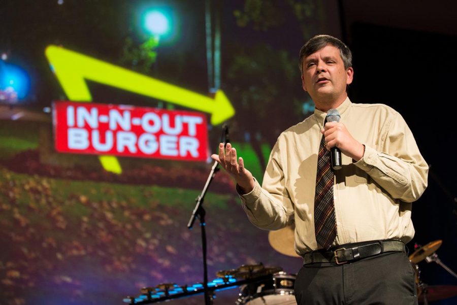 Professor Weathers shares a story with the crowd about and comedic In-n-Out drive through experience. | Jenny Oetzell/THE CHIMES