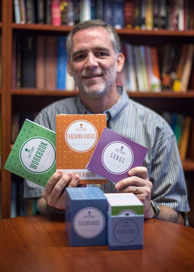 Bible professor Kenneth Berding hold his new program called “Bible Fluency” which is designed to combat biblical illiteracy. | Johnathan Burkhardt/THE CHIMES 