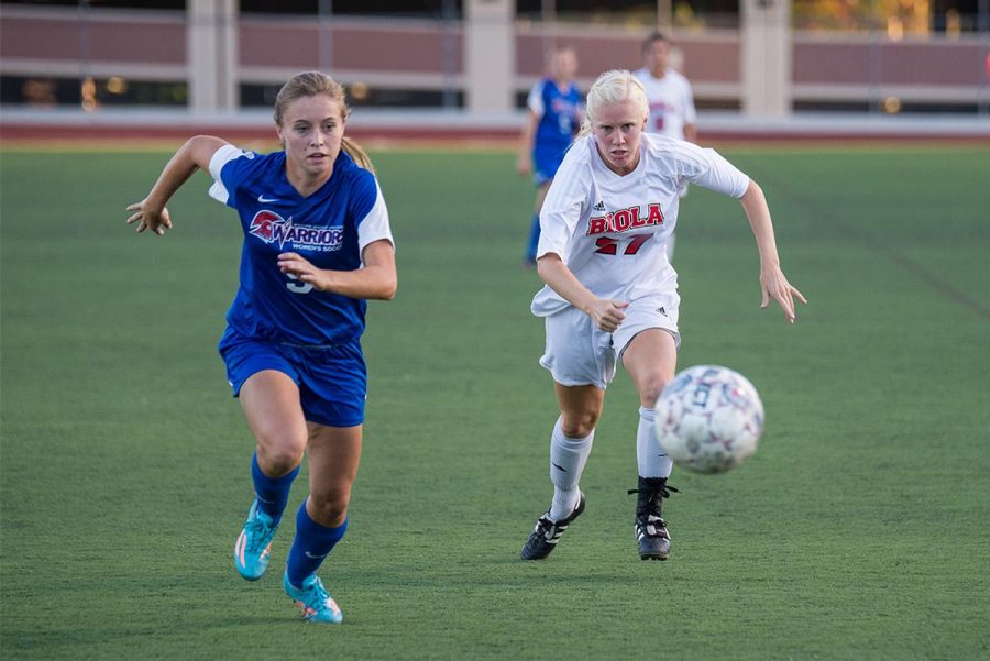 Freshman midfielder Janae Megorden races against a William Jessup University player at the game on Oct.4. | Jenny Oetzell/THE CHIMES