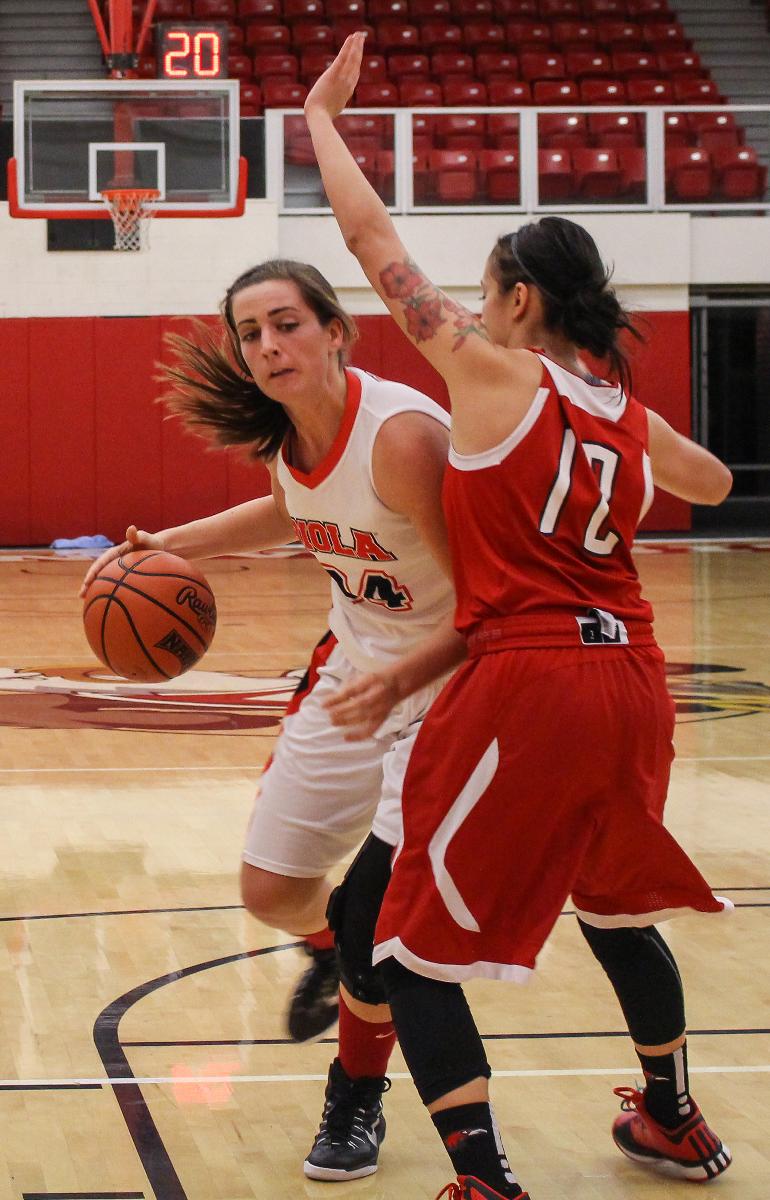 Senior forward Chelsea Hill dodges a player from Azusa University on Nov. 11. | Molli Kaptein/THE CHIMES 