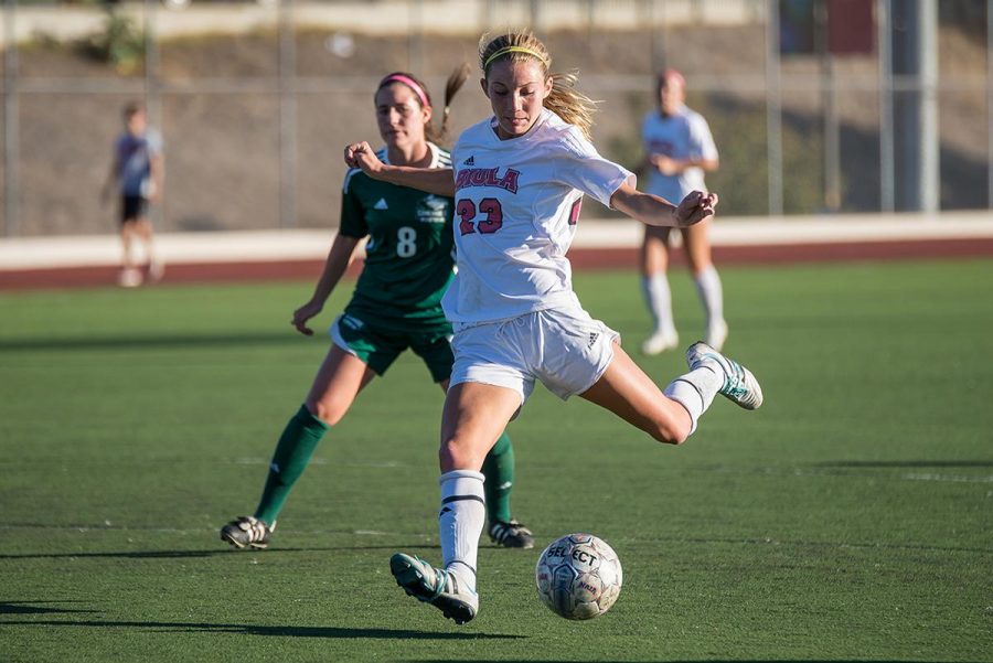 Sophomore Taylor Venegas kicks the ball into the goal scoring the second point of the game against Concordia University on Nov. 4. 