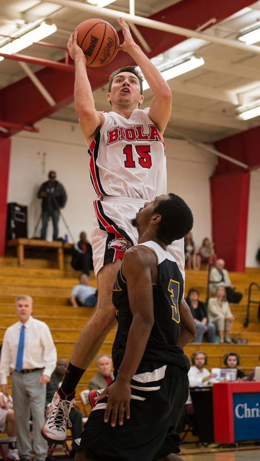 Sophomore guard Grant Corsi jumps up to score against La Sierra on Nov. 12.  | Jenny Oetzell/THE CHIMES