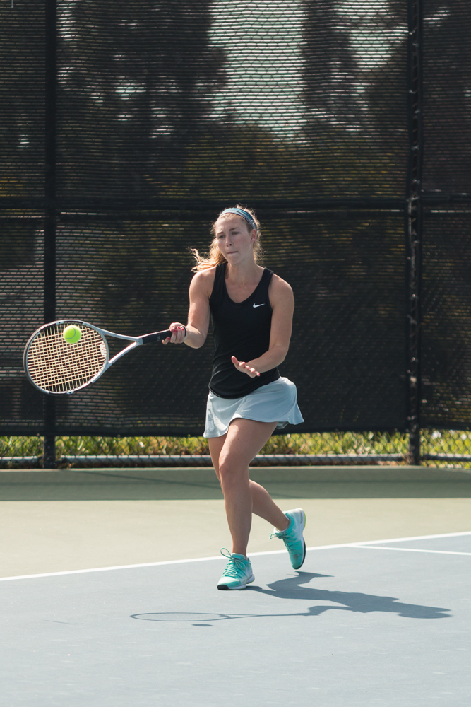 Senior Lauren Vogel striking the ball during the match against Vanguard University on Feb 20. | Marissa Osswald/THE CHIMES