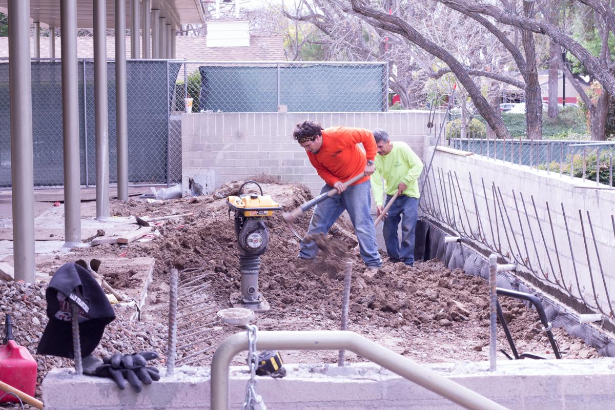 Construction crew members hard at work to complete the Heritage Cafe ahead of schedule. | Molli Kaptein/THE CHIMES